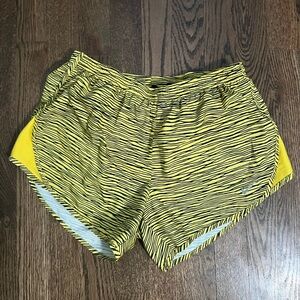 Black and yellow pattern Nike running shorts